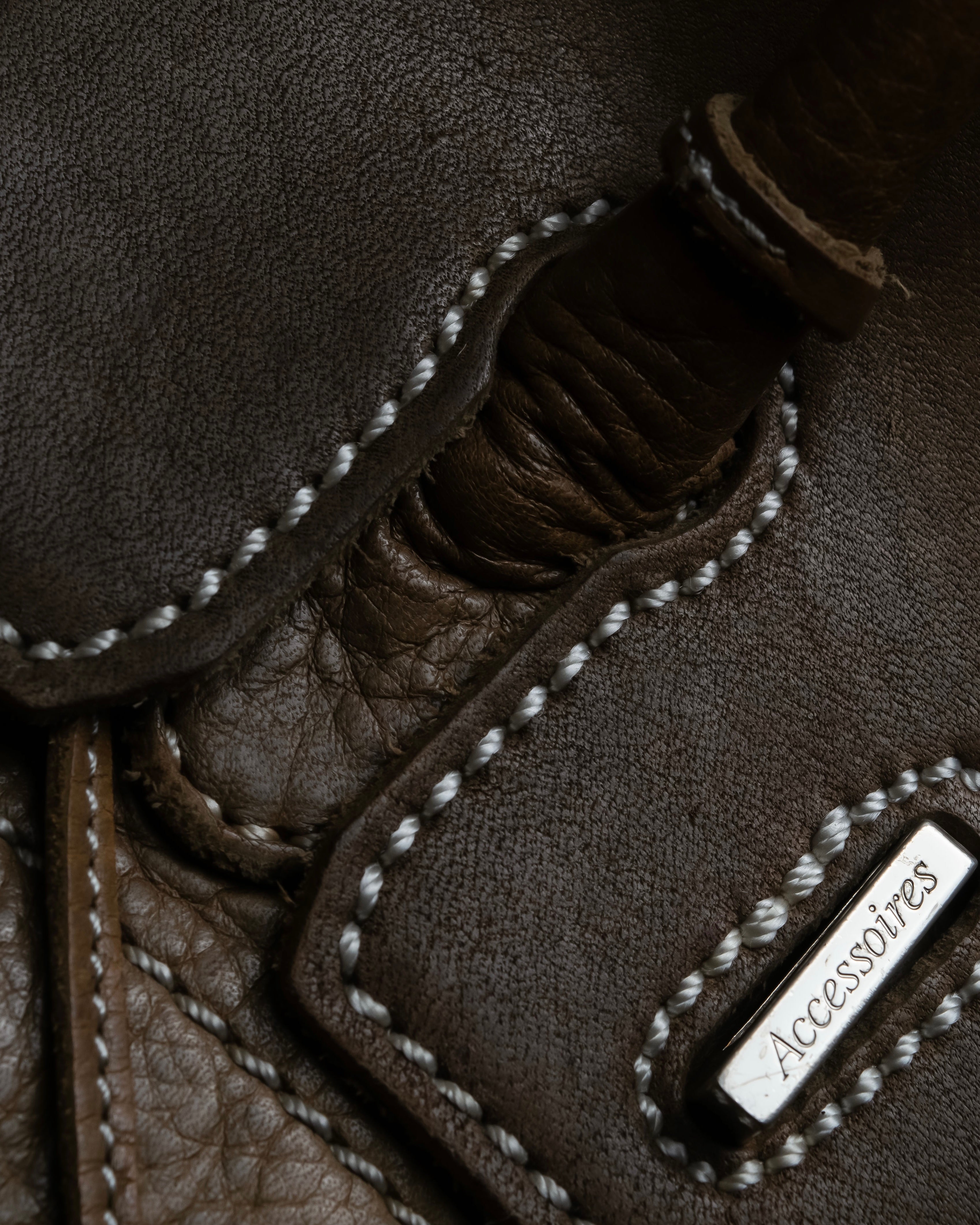 "Mademoiselle Accessories"
 Silver parts design leather one handle bag