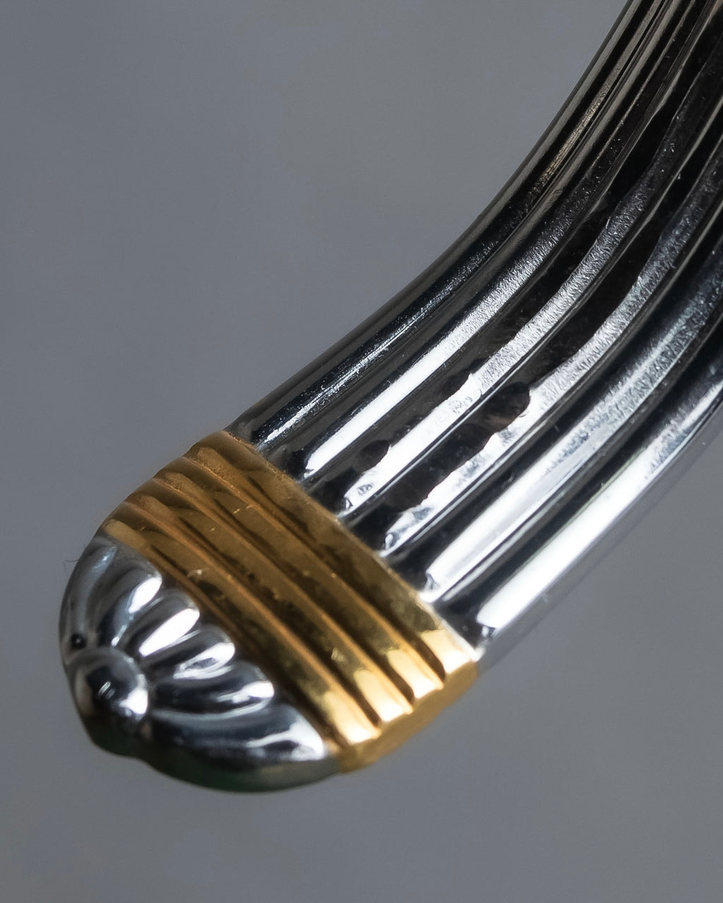 "Christian Dior" Ribbed design gold combination polished silver bangle