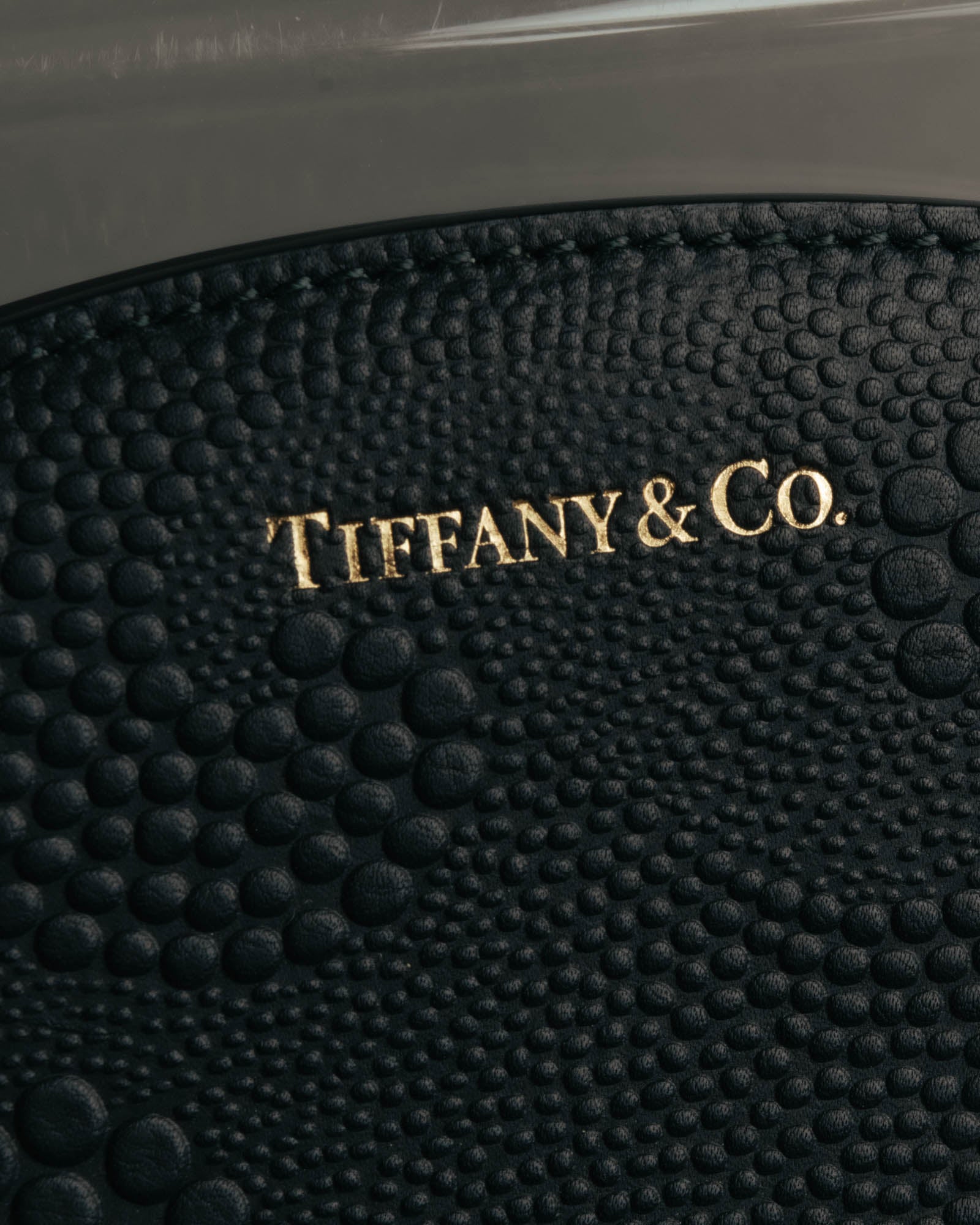 "Tiffany & Co." 10's-20's Embossed leather wristlet wallet