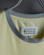 "MAISON MARGIELA"
Pastel yellow color box silhouette T-shirt