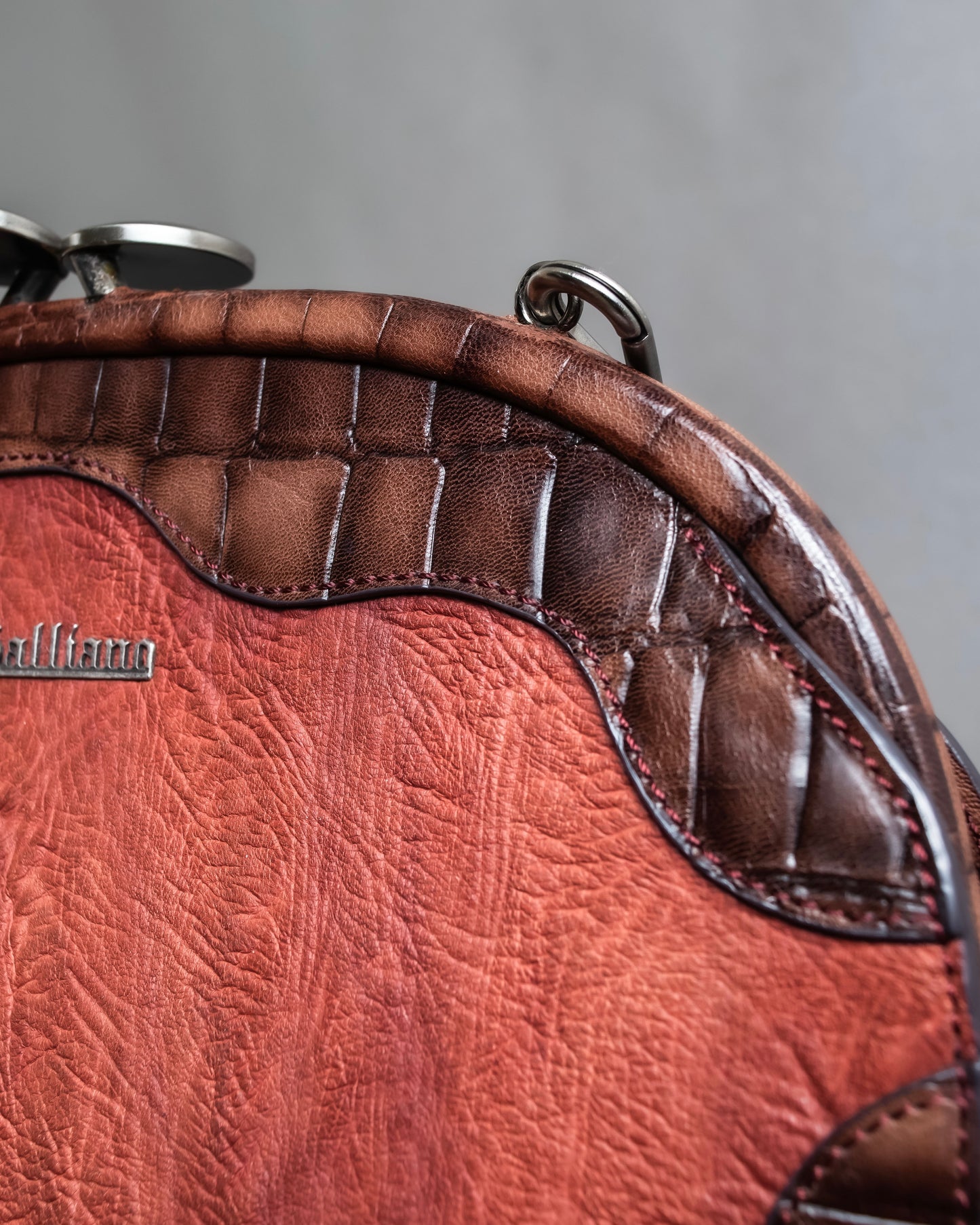 "John Galliano" Trapezoid design clasp different leather hand bag