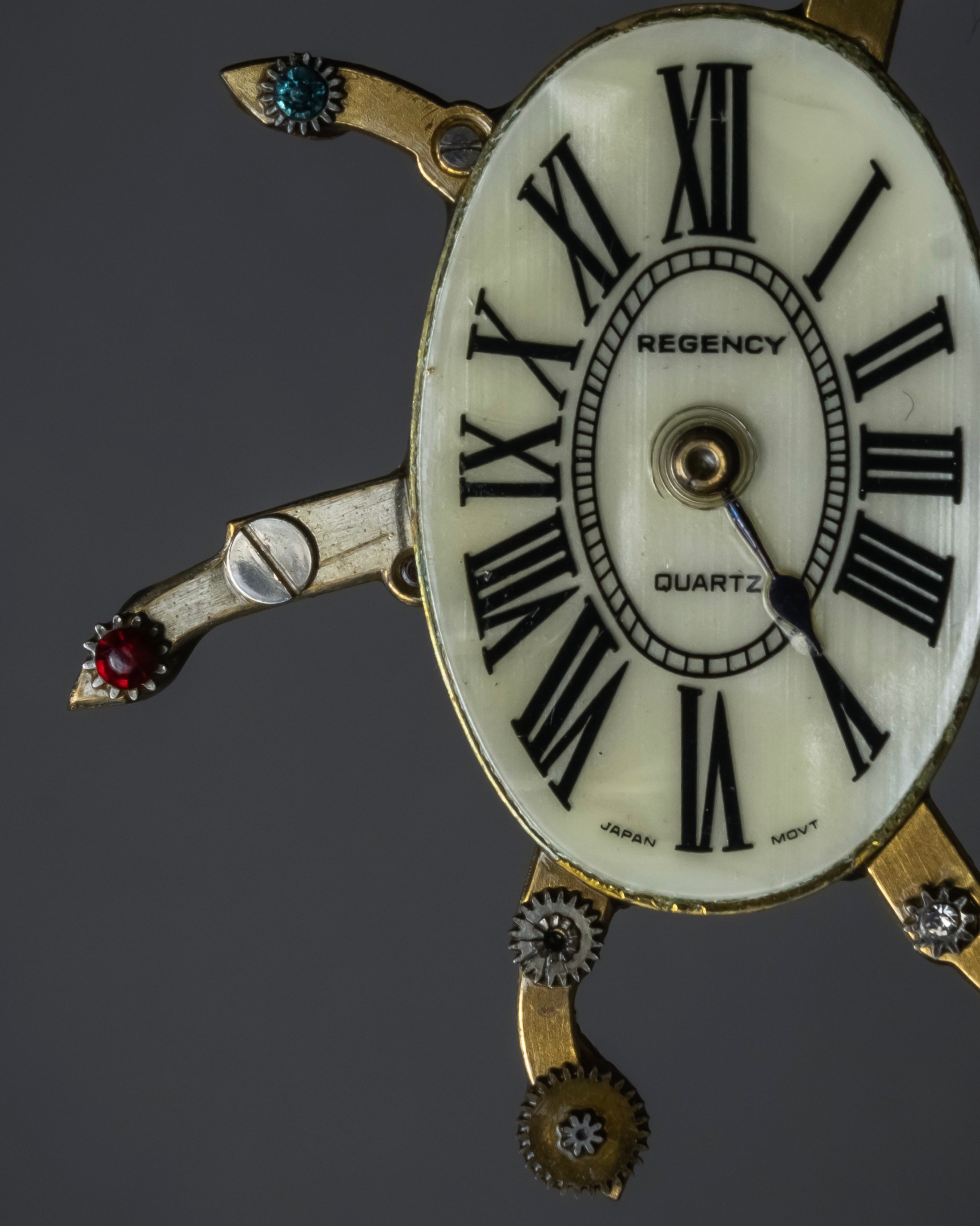 "Jerry Robertson design clock motif brooch"