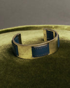 “HERMÈS” 90’s-00’s Leather inset gold metal cuff bangle