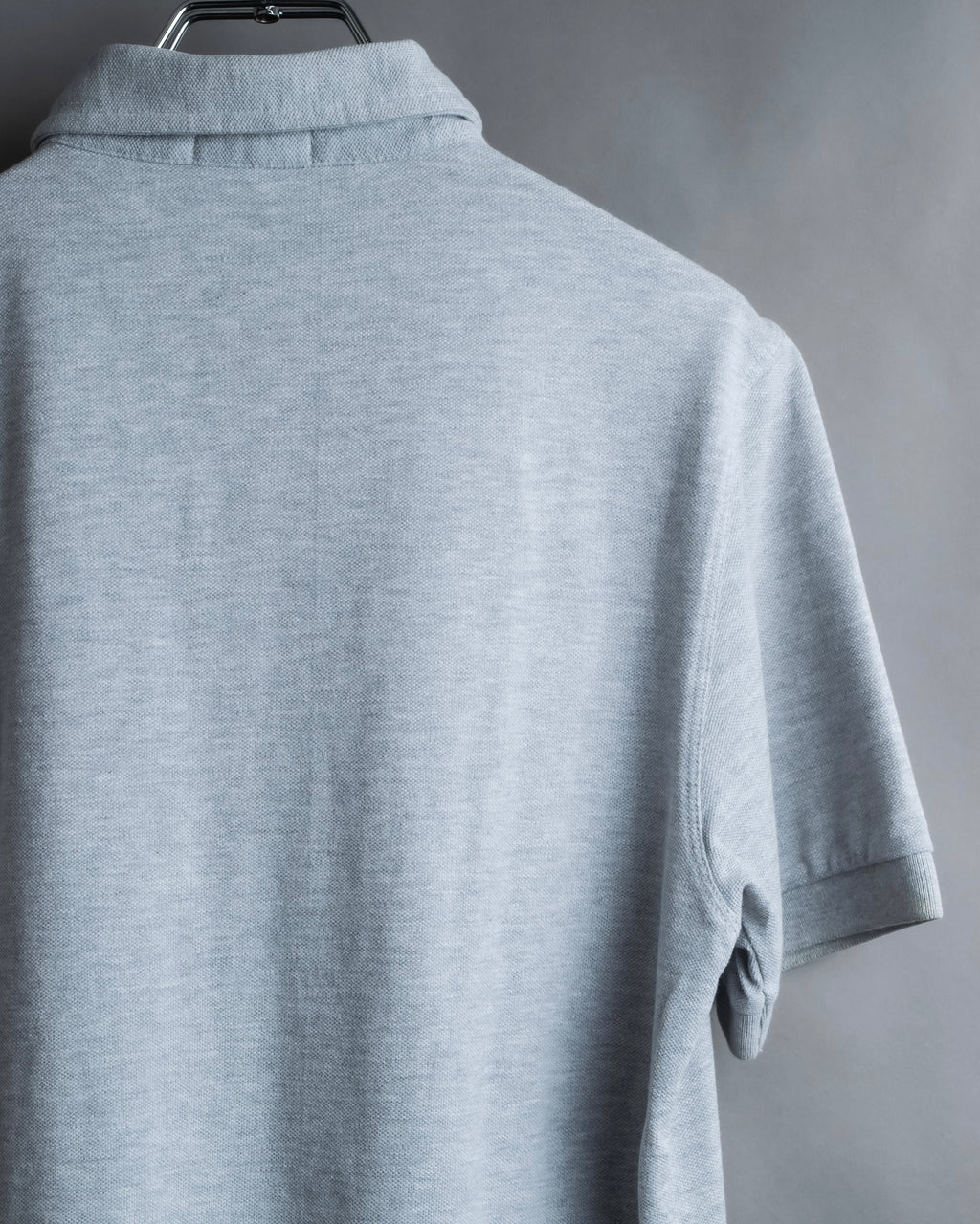 "BURBERRY" Knight logo engraved metal button polo shirt