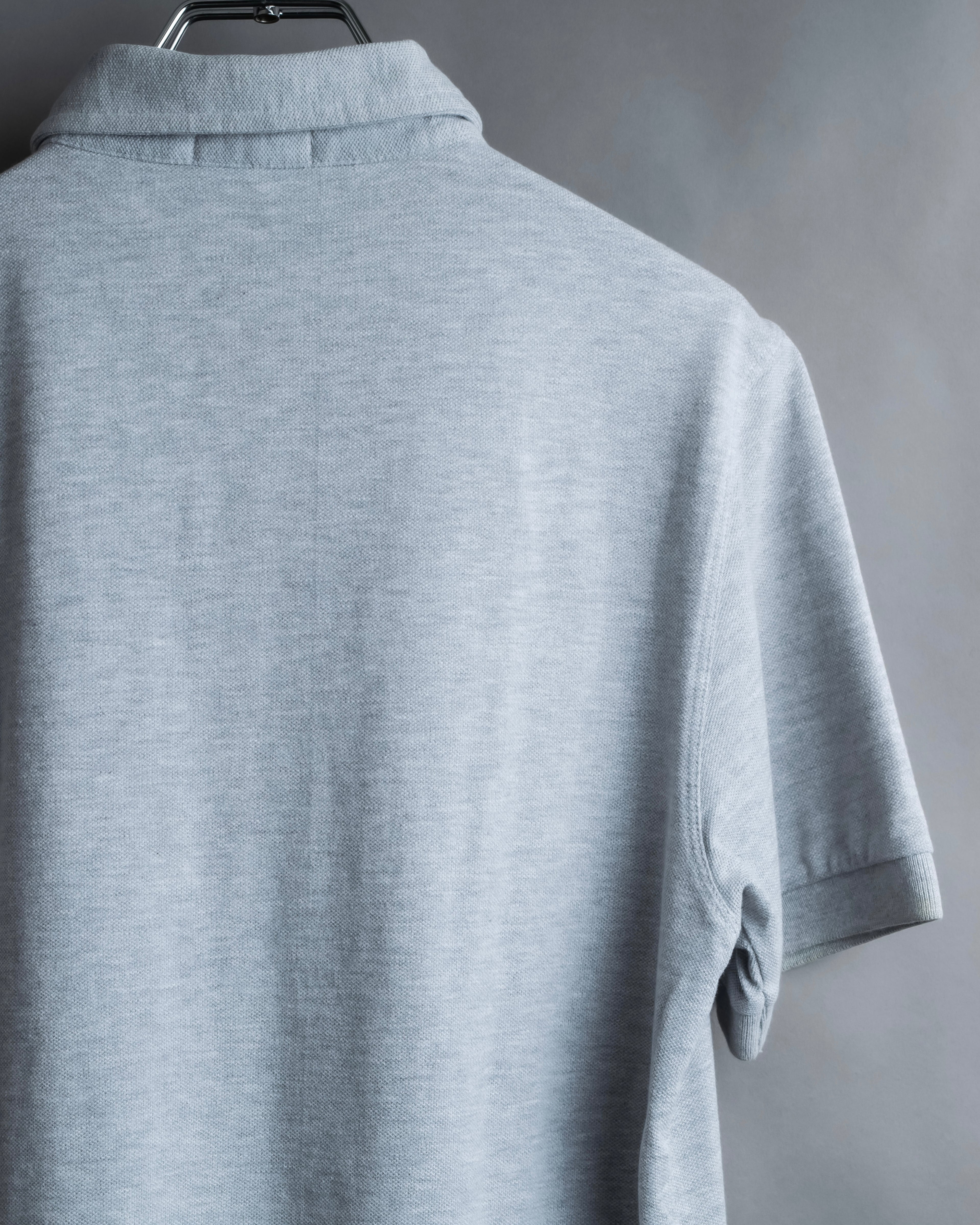 "BURBERRY" Knight logo engraved metal button polo shirt