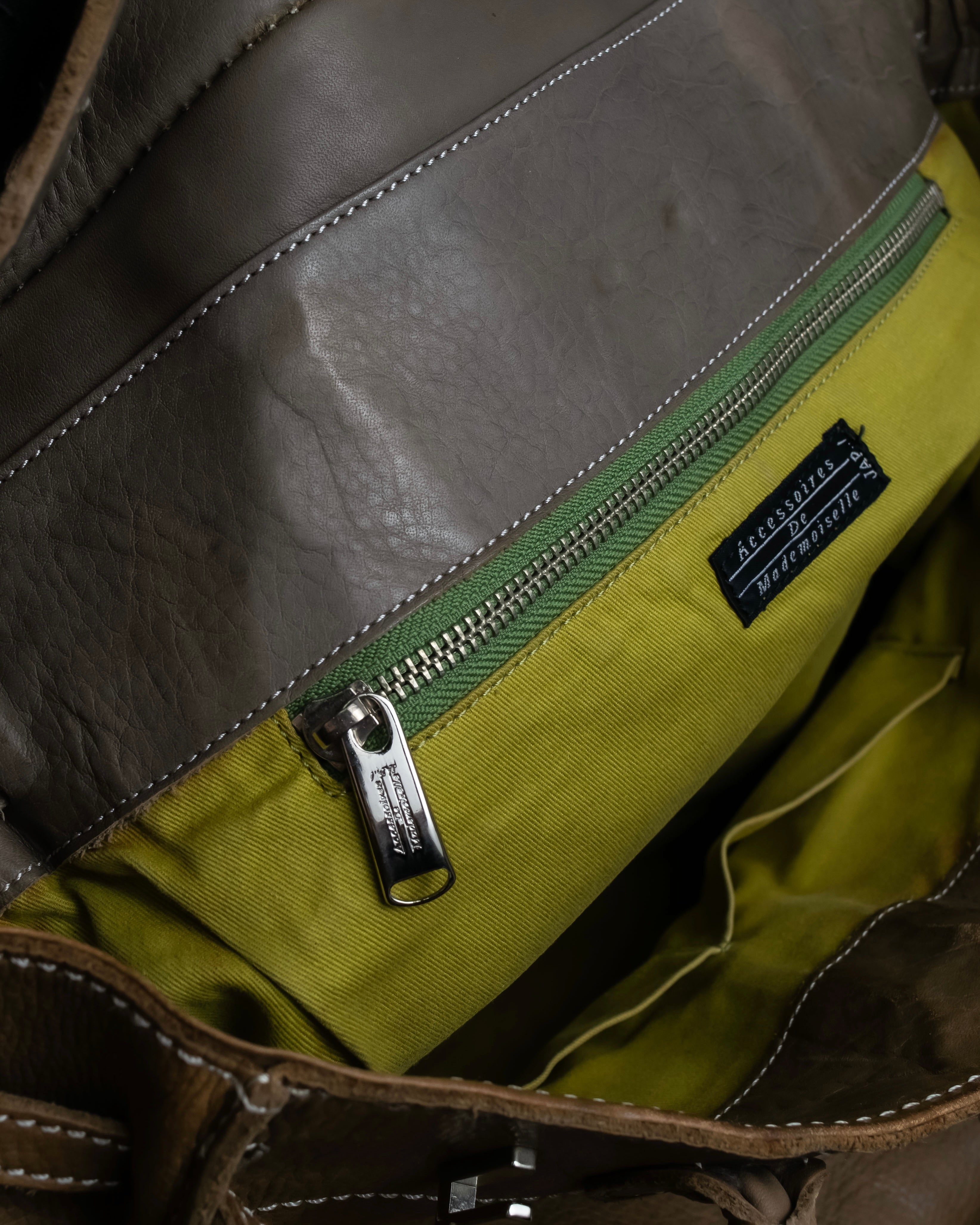 "Mademoiselle Accessories"
 Silver parts design leather one handle bag