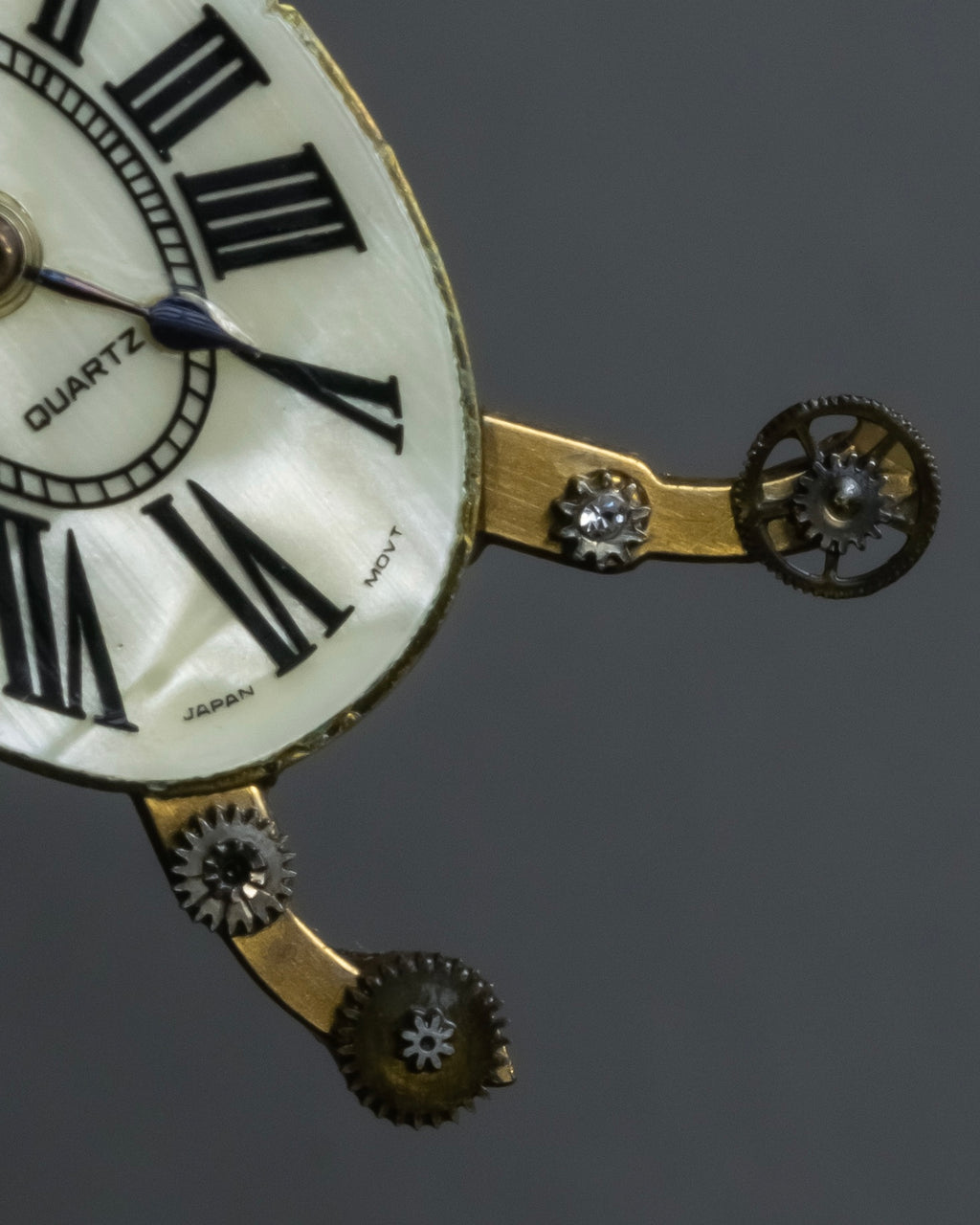 "Jerry Robertson design clock motif brooch"