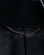 "JOHN LAWRENCE SULLIVAN"
 Large lapel double-breasted mid length coat