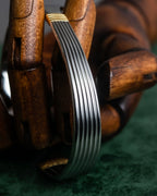 "Christian Dior" Ribbed design gold combination polished silver bangle