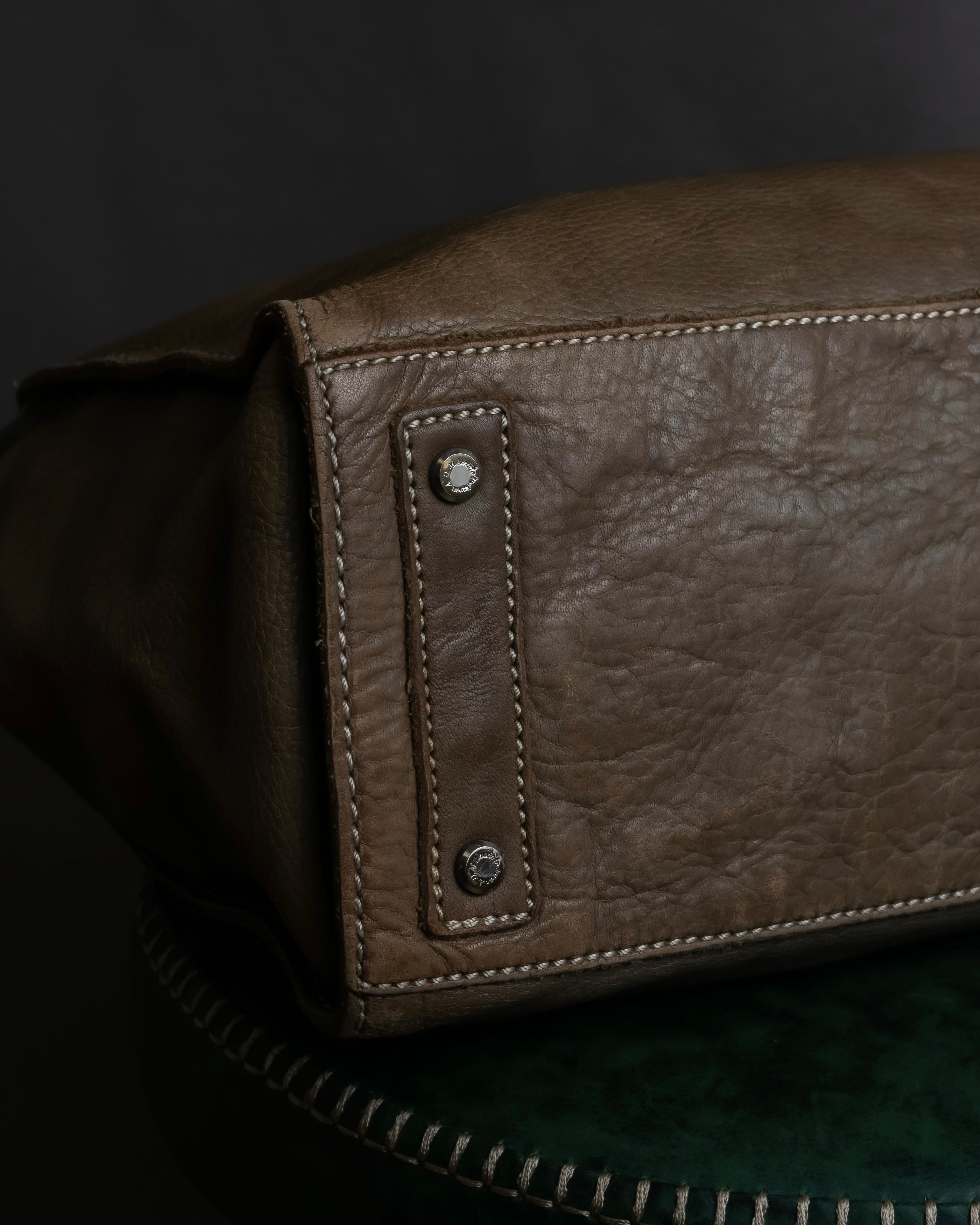 "Mademoiselle Accessories"
 Silver parts design leather one handle bag