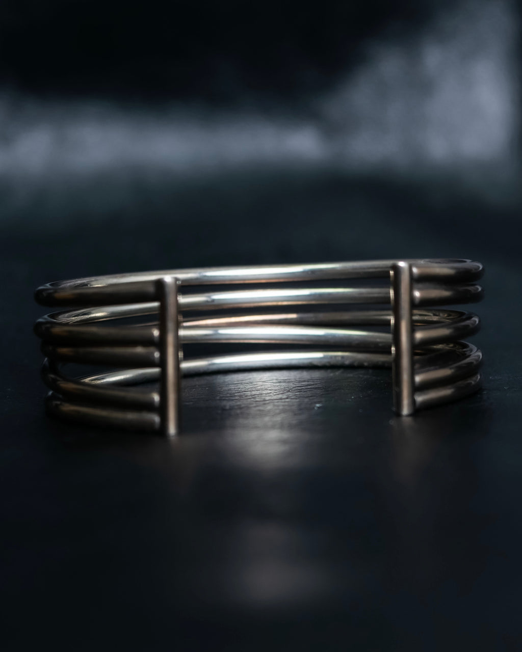 “PHILIPPE AUDIBERT” Crossed 5 line silver bangle