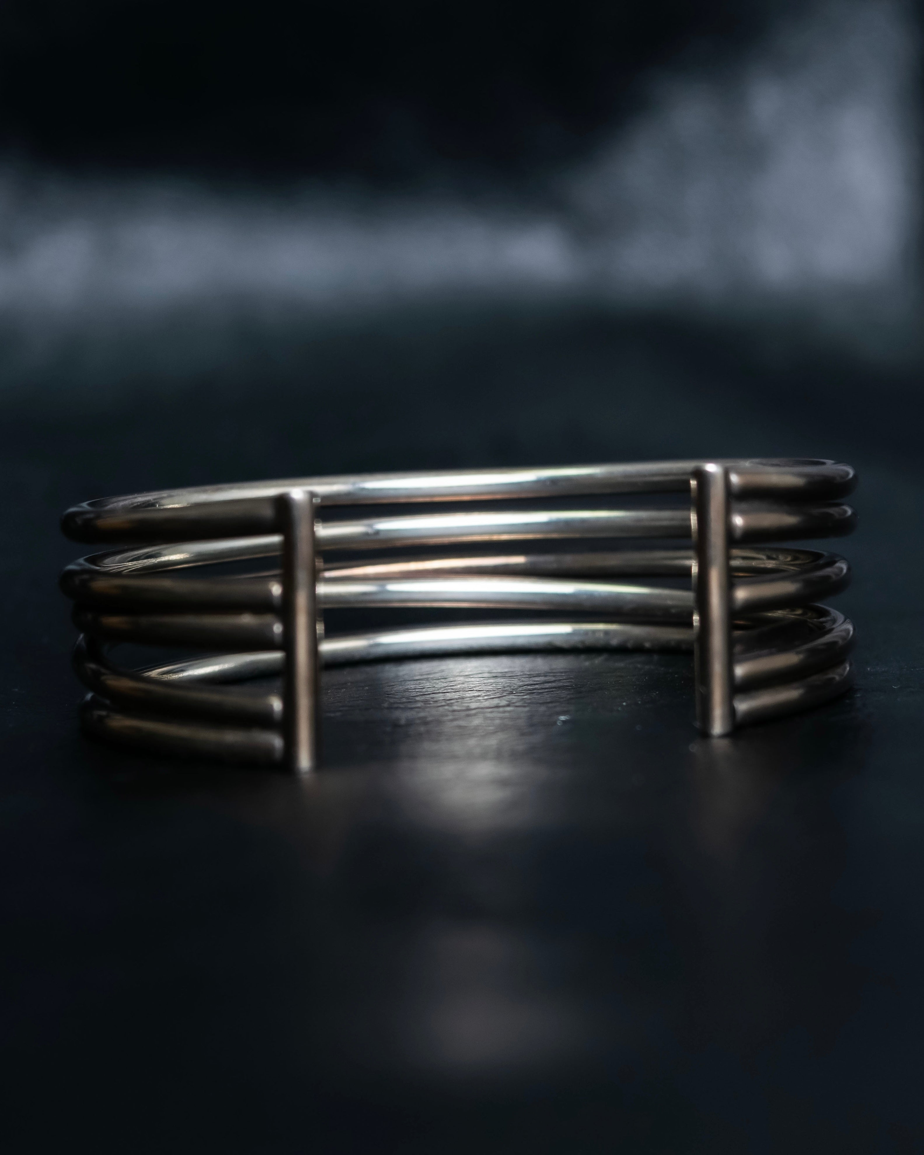 “PHILIPPE AUDIBERT” Crossed 5 line silver bangle