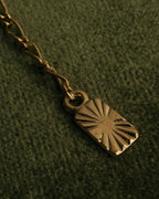 "Yves Saint Laurent" 80's-00's Gold tone textured pendant necklace