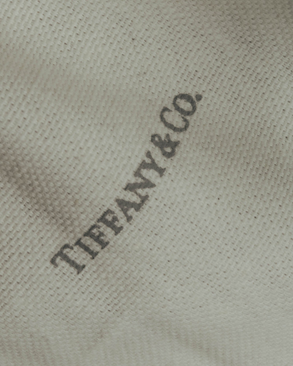"Tiffany & Co." 10's-20's Embossed leather wristlet wallet