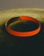 "Hermès" 00's Vibrant orange leather bracelet