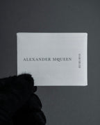 "Alexandar McQueen" Horseshoe motif red stone top ring