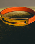 "Hermès" 00's Vibrant orange leather bracelet