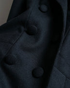 Tight-waisted wool shirt and black coat