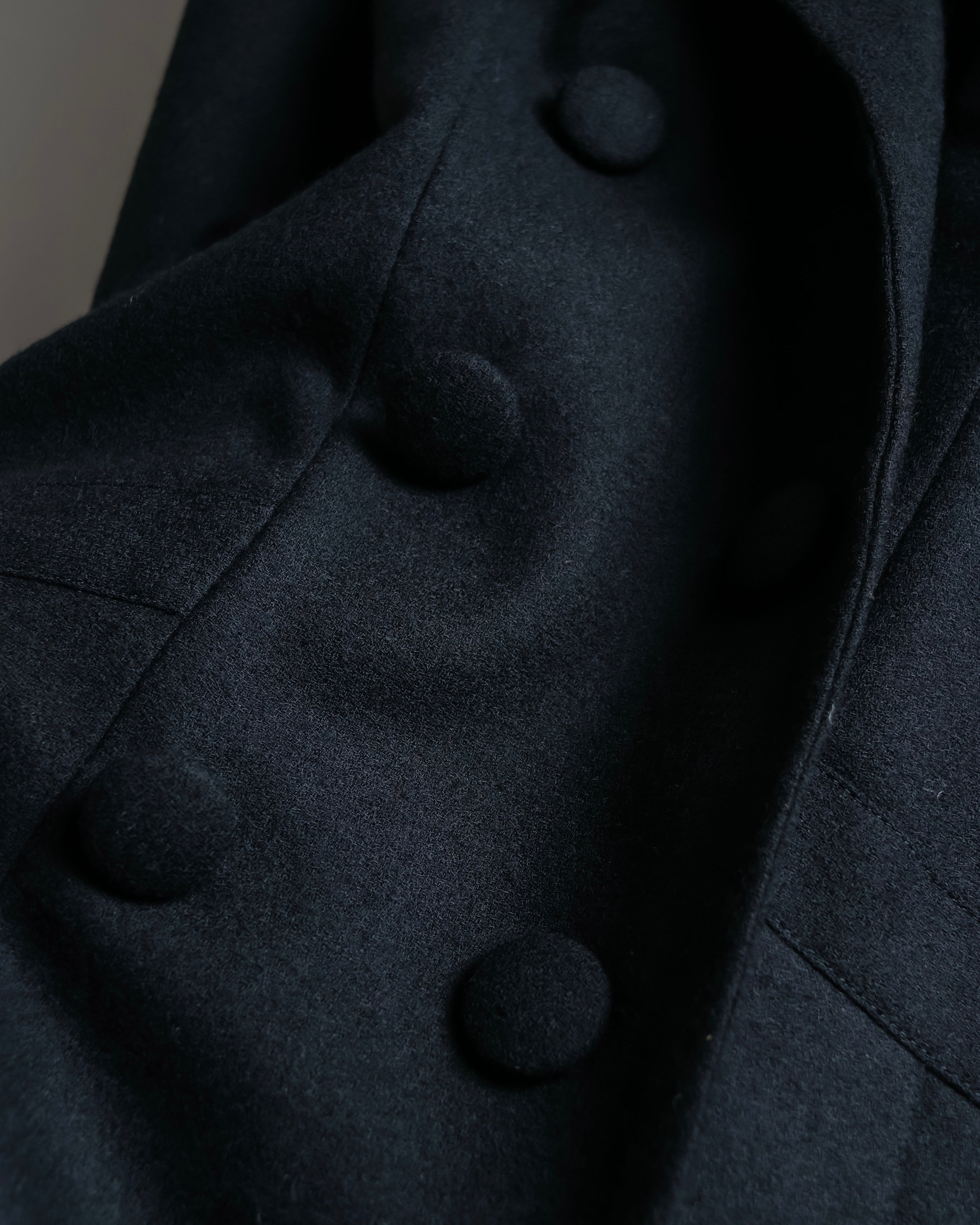 Tight-waisted wool shirt and black coat