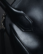 "Y’s" 22AW sculptural kiss-lock leather bag