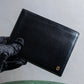 "Cartier" 2C logo engraved leather bi-fold wallet