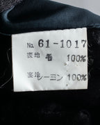 Tight-waisted wool shirt and black coat