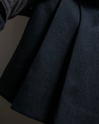 Tight-waisted wool shirt and black coat