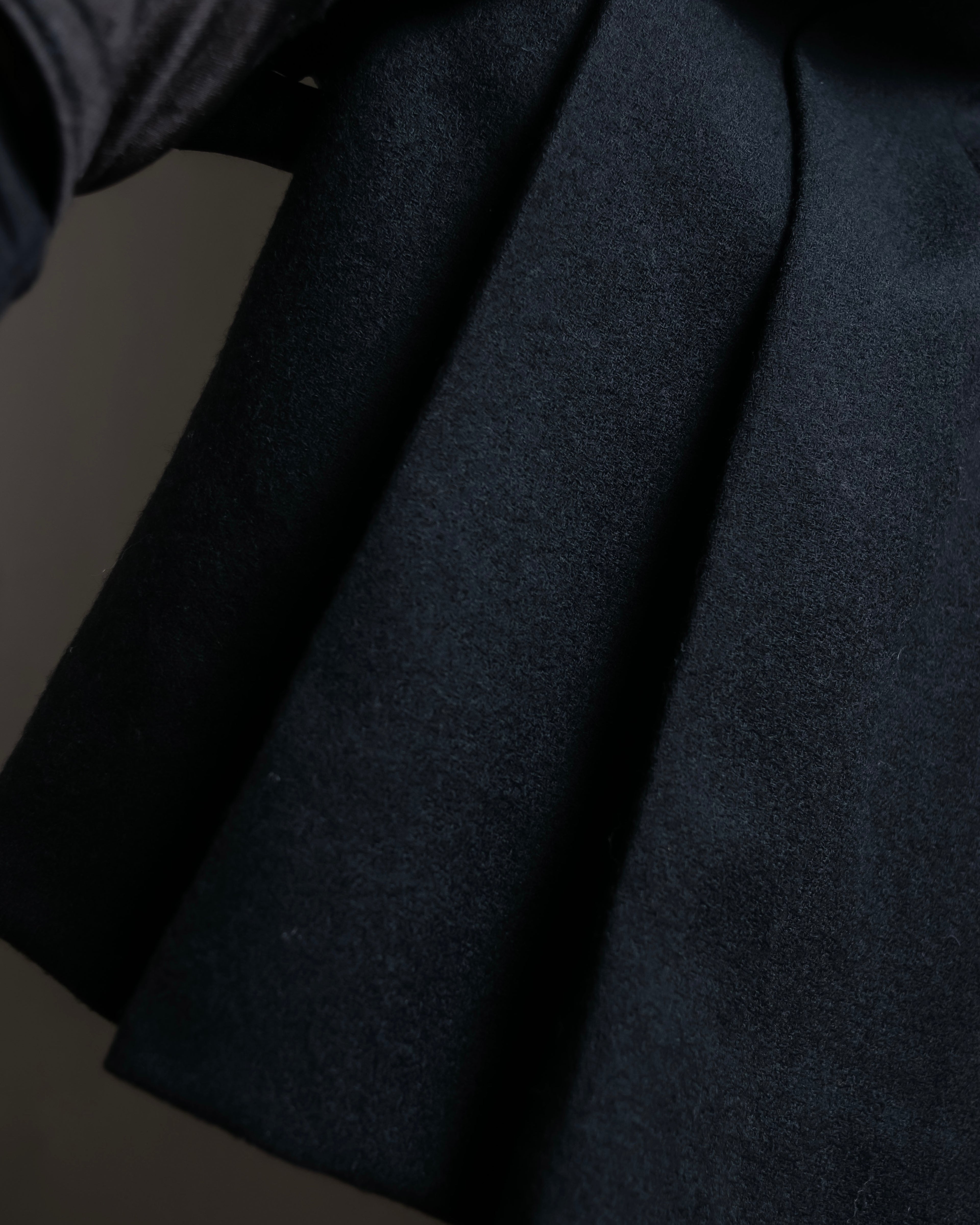 Tight-waisted wool shirt and black coat