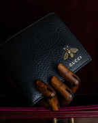 "GUCCI" Gold bee motif animalier bi-fold leather wallet