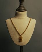 “NINA RICCI” Late 80’s-90’s gold tone openwork pendant necklace