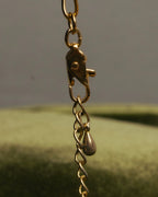 "YVES SAINT LAURENT" 80's-90's Gold-tone rolo chain necklace with faux pearl accents