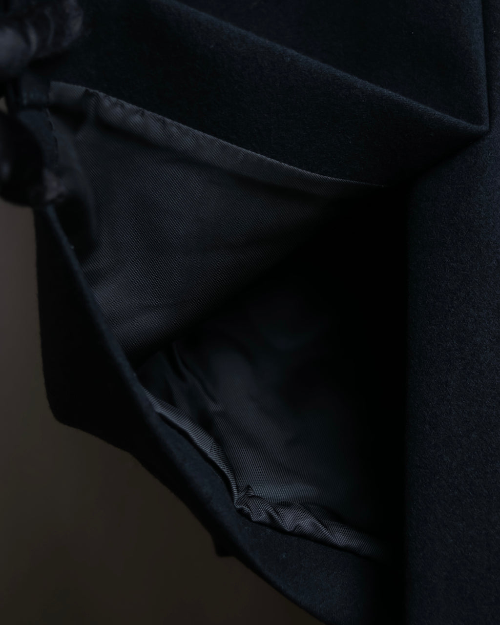 "JOHN LAWRENCE SULLIVAN"
 Large lapel double-breasted mid length coat