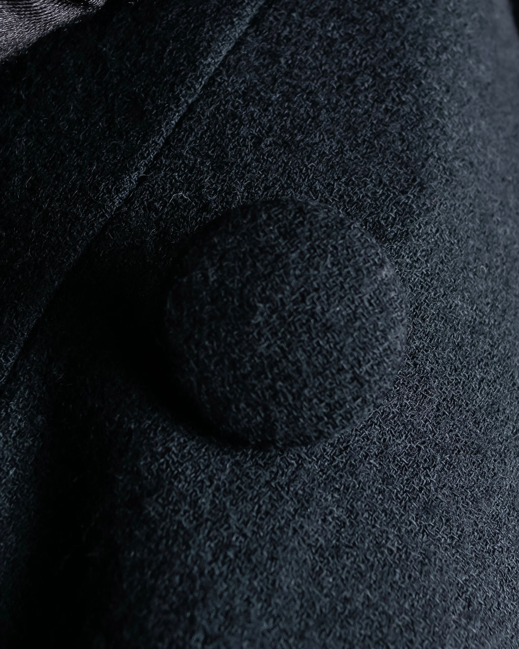 Tight-waisted wool shirt and black coat