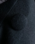 Tight-waisted wool shirt and black coat