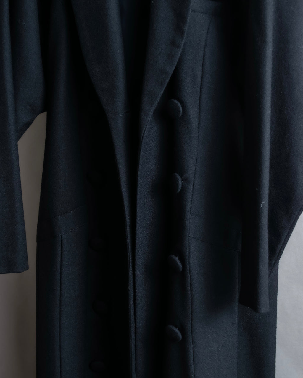 Tight-waisted wool shirt and black coat