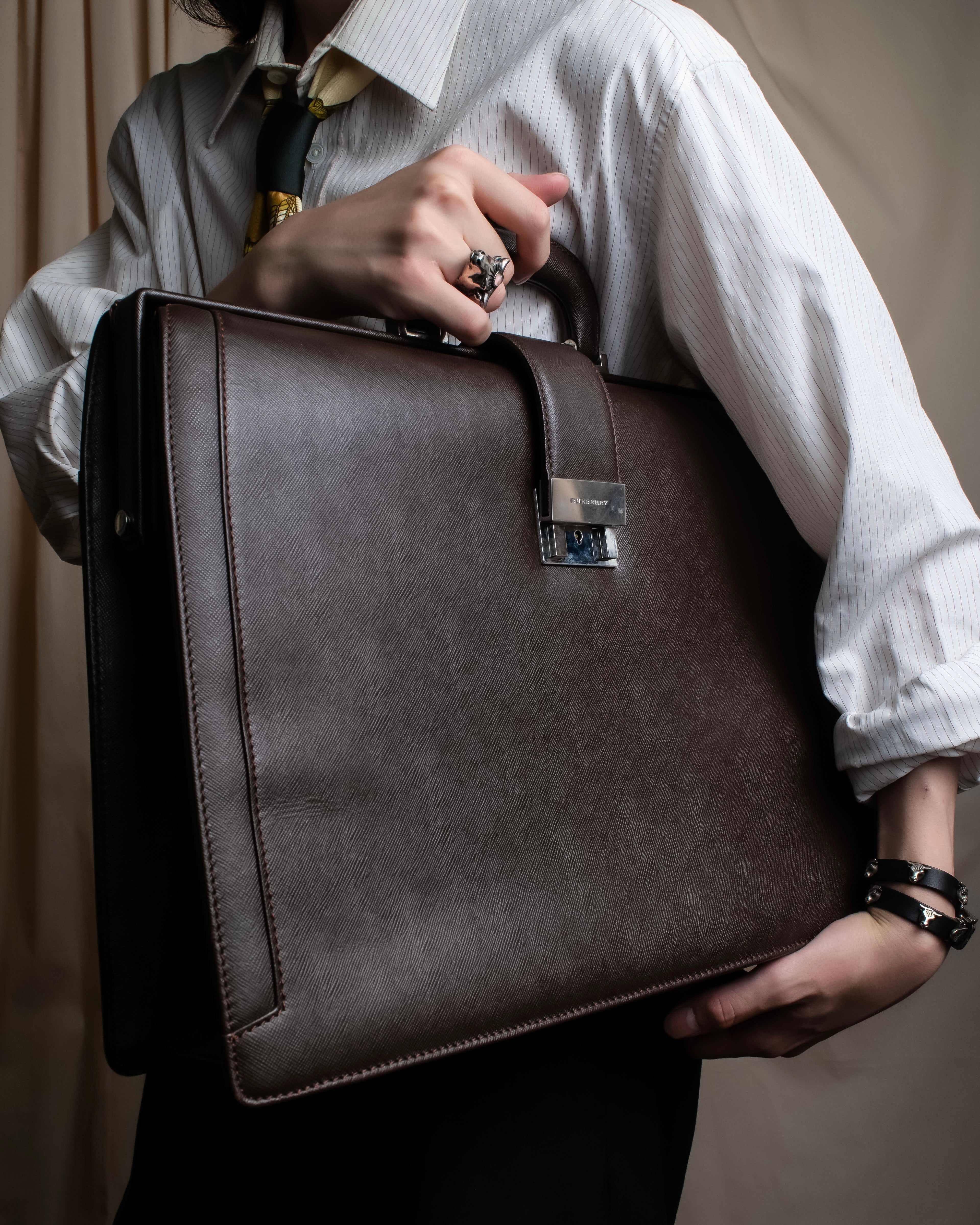 "BURBERRY" Metal belt design embossed PVC briefcase