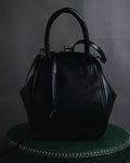 "Y’s" 22AW sculptural kiss-lock leather bag