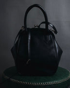 "Y’s" 22AW sculptural kiss-lock leather bag