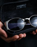 “CHANEL”  metal plate flame oval sunglasses