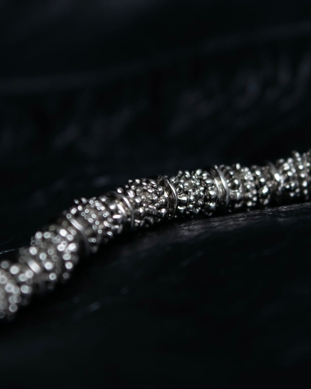 "Yves Saint Laurent"
Different sized beads silver necklace