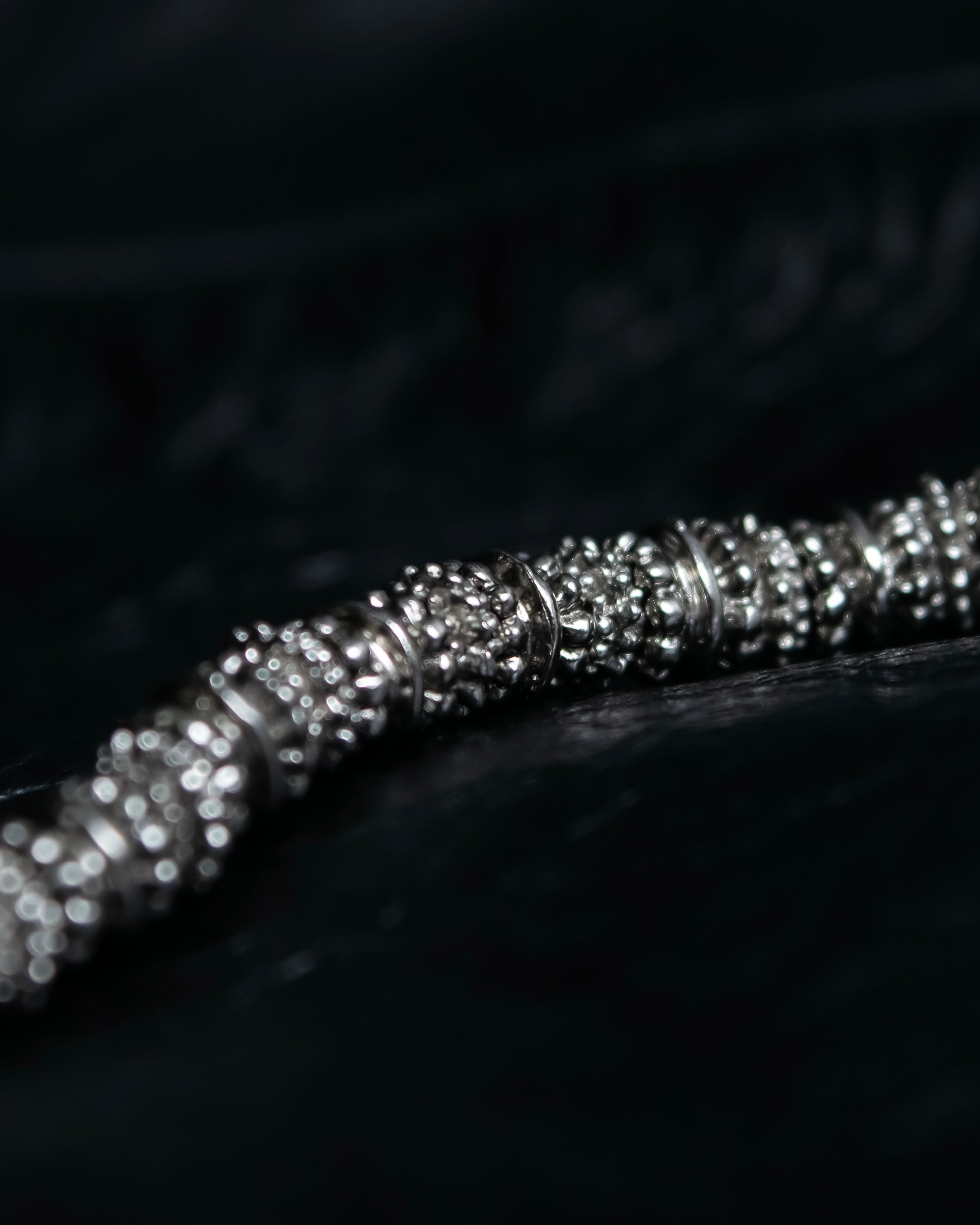 "Yves Saint Laurent"
Different sized beads silver necklace