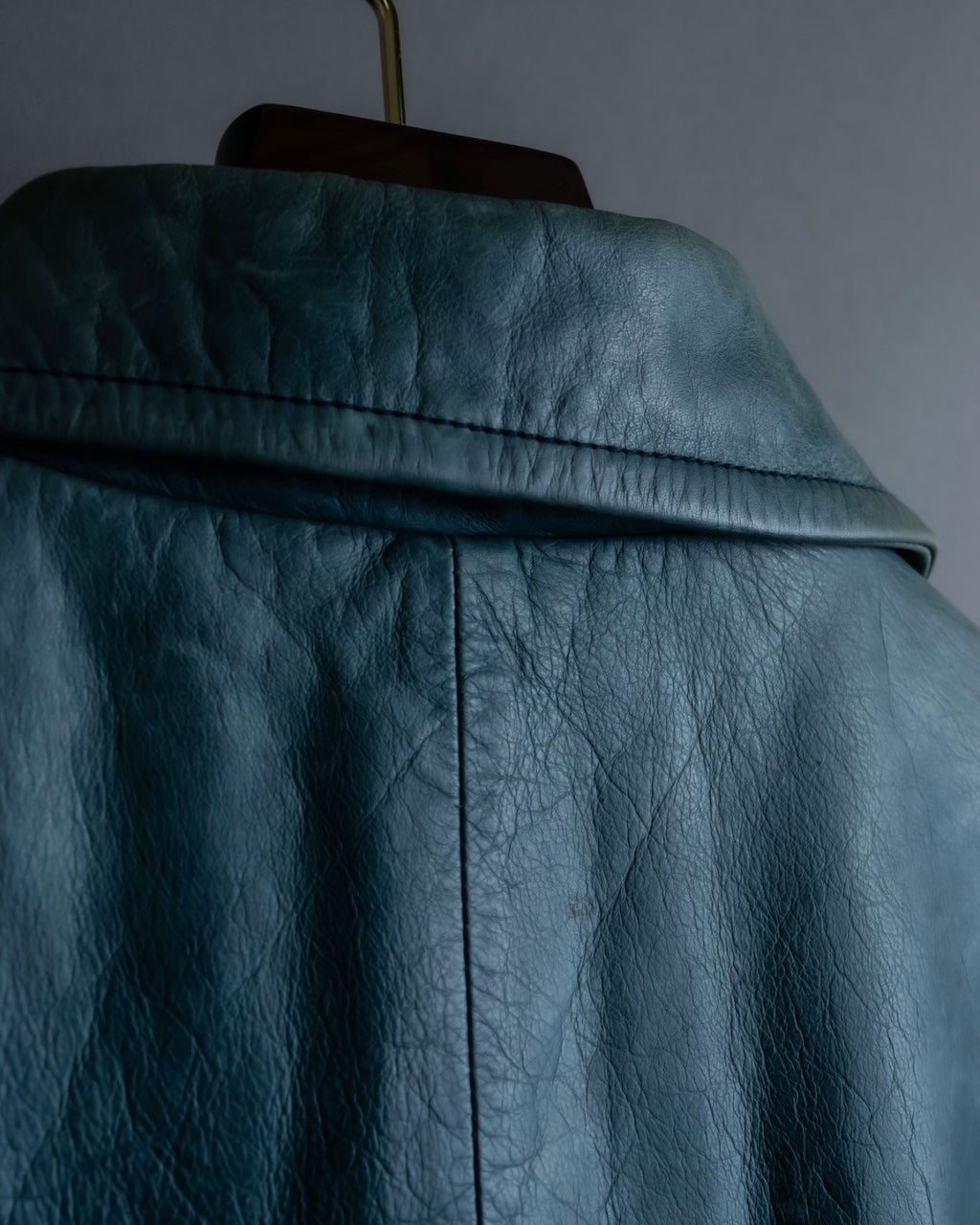 "COACH" light blue faded leather coat