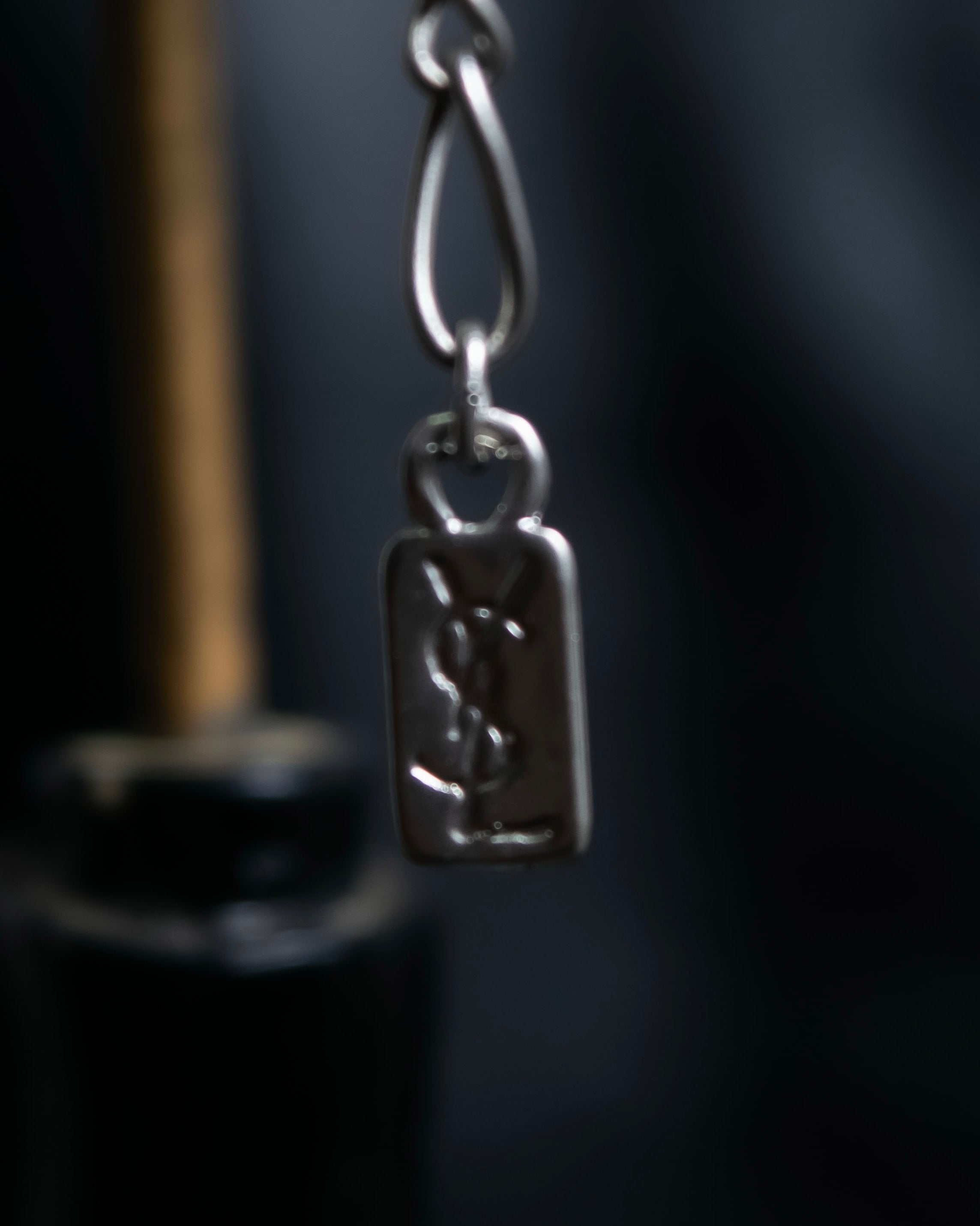 "Yves Saint Laurent"
Different sized beads silver necklace