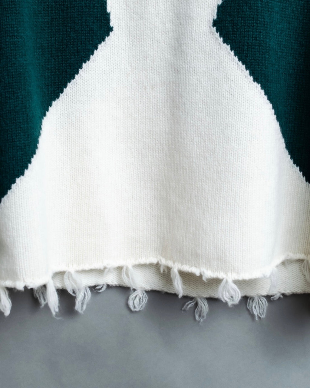 Distressed long sleeve knit