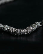 "Yves Saint Laurent"
Different sized beads silver necklace