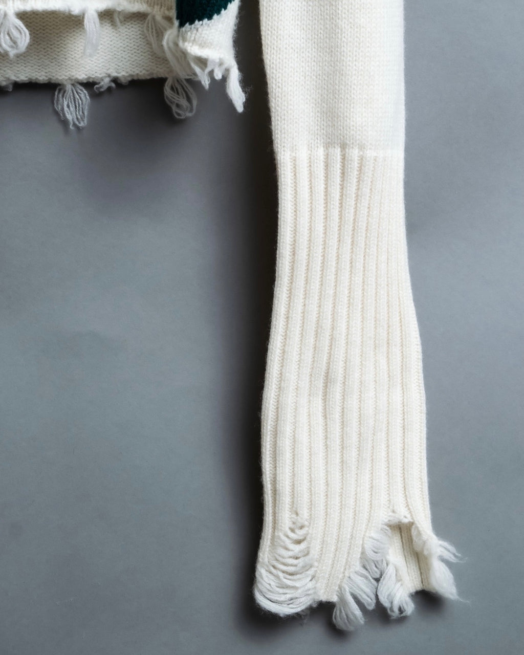 Distressed long sleeve knit