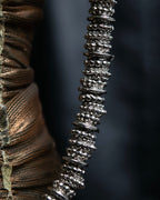 "Yves Saint Laurent"
Different sized beads silver necklace