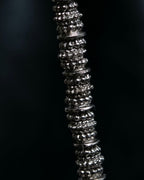 "Yves Saint Laurent"
Different sized beads silver necklace