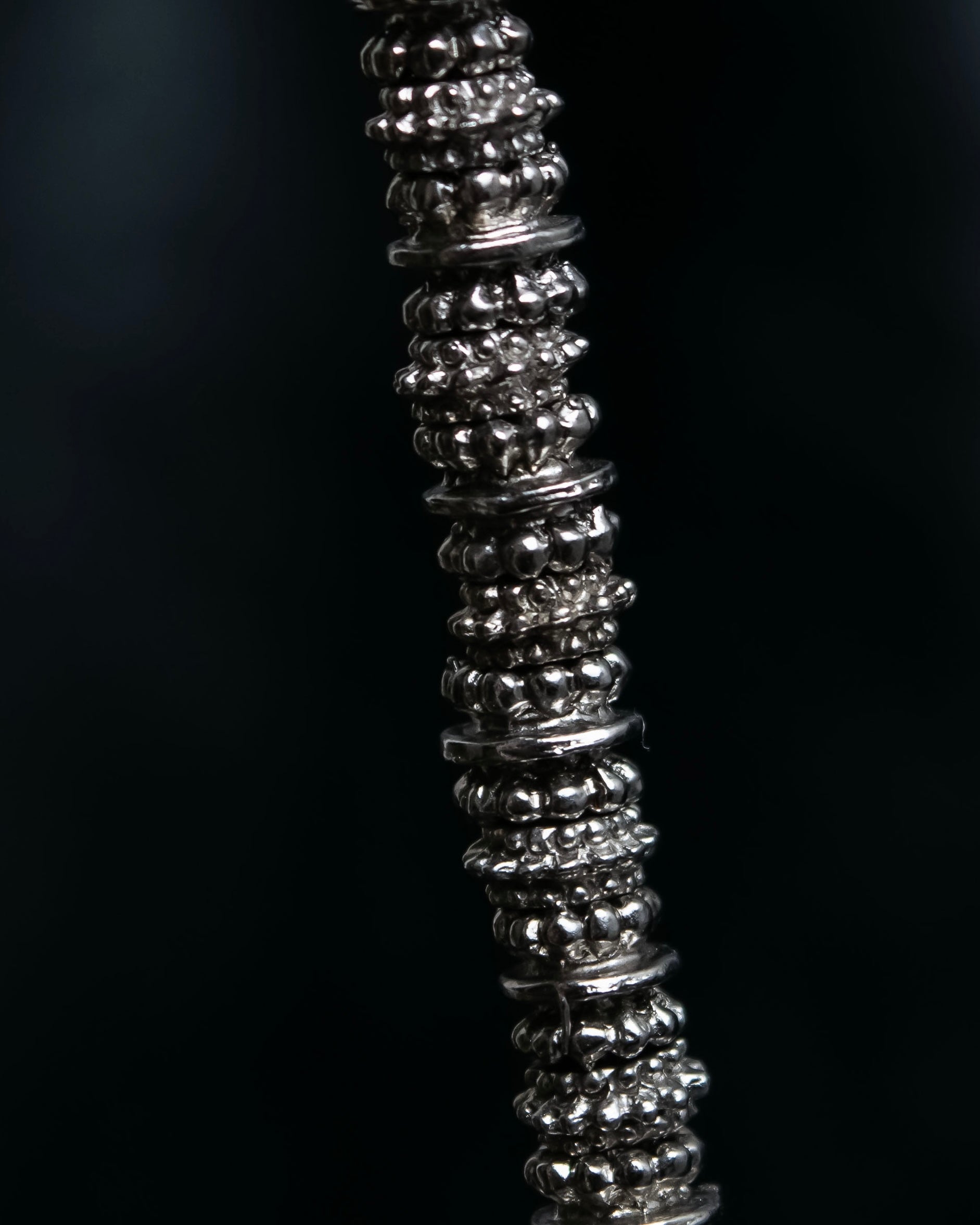 "Yves Saint Laurent"
Different sized beads silver necklace