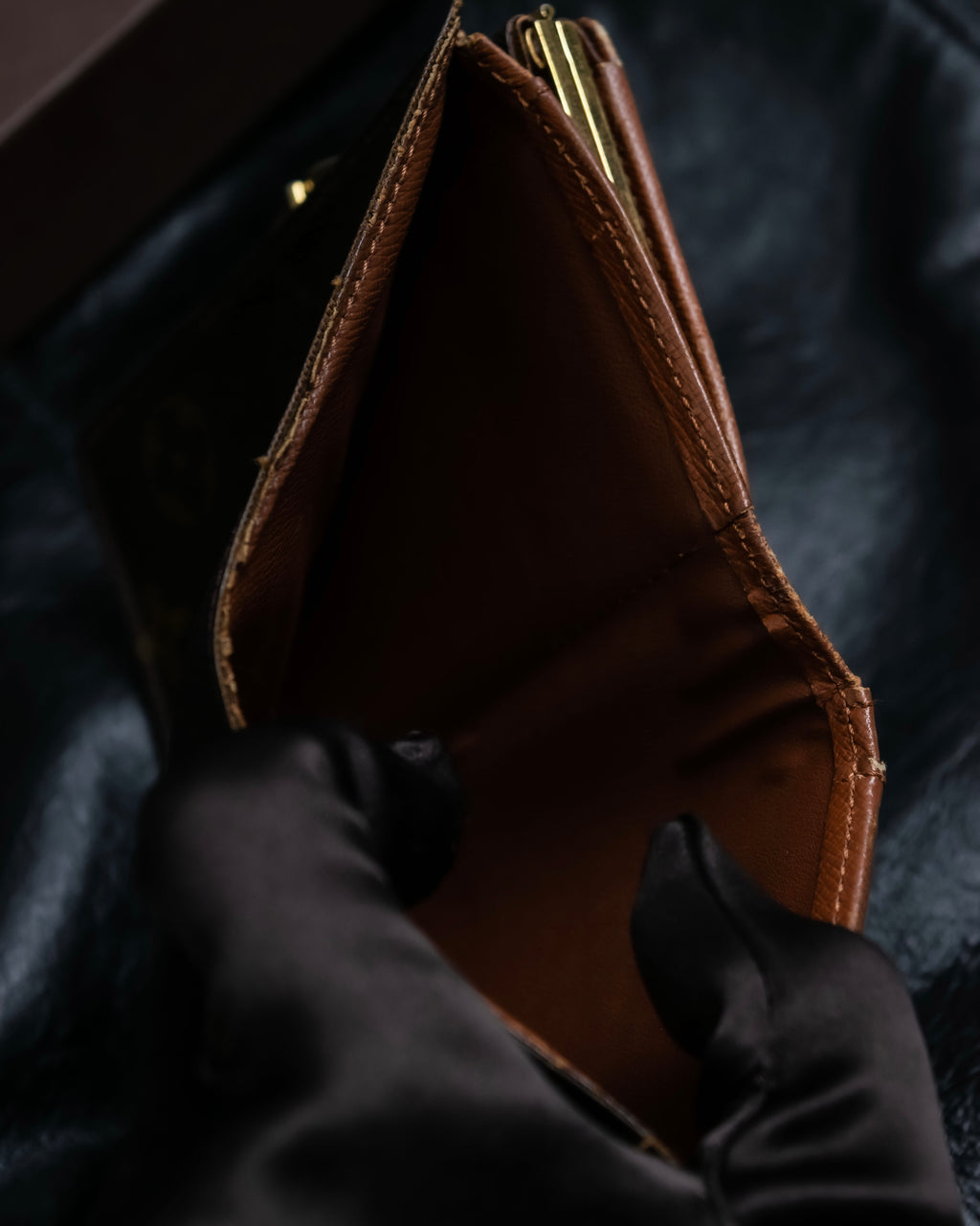 “Louis Vuitton” gold attachment designed monogram wallet